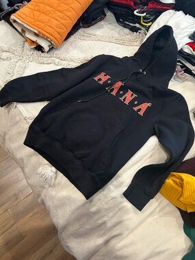 M.A.N.Á Black Pullover Hoodie with Red Lettering